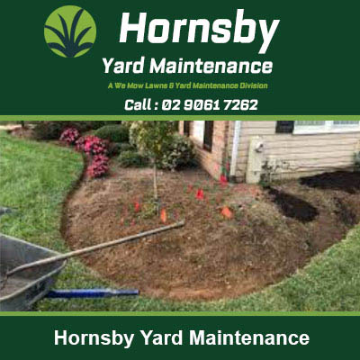Garden bed being prepared with soil and rake in Hornsby
